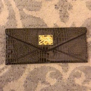 Lilly Pulitzer patent faux snakeskin brown clutch.